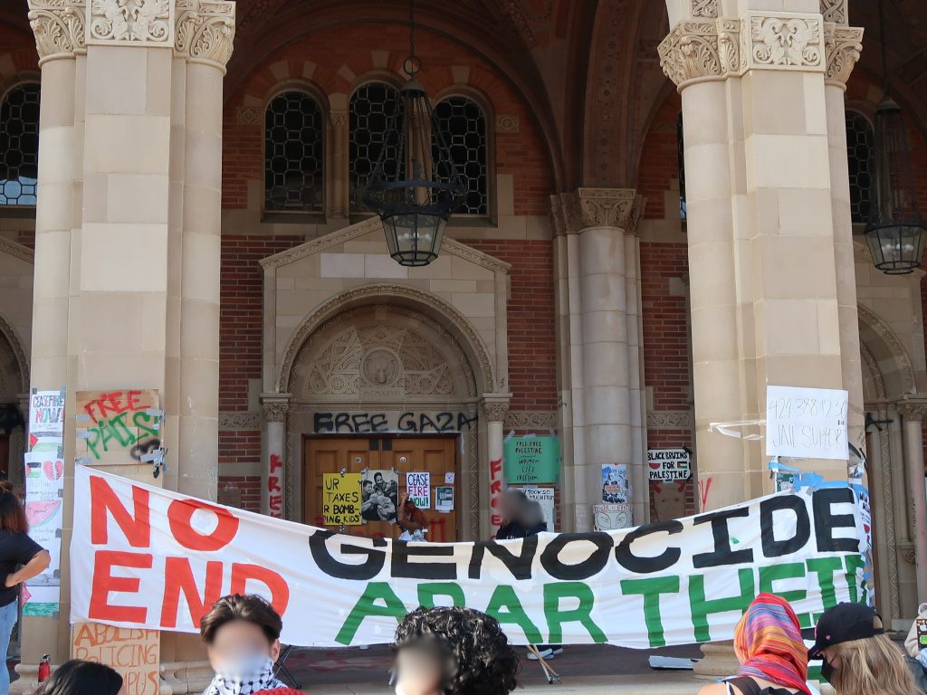 UCLA Palestine Solidarity Encampment banner with the text "No Genocide. End Apartheid."